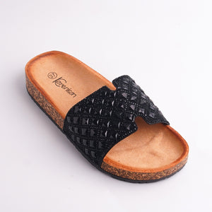 Side view of black Studded Slides showing cork sole and platform height, casual summer sandals.