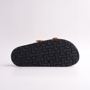 Bottom view of the Rose Gold Slide showing the black patterned anti-slip sole.