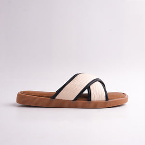 Beige sandal with brown sole on a light gray background