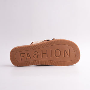 Brown sandal sole with 'FASHION' embossed on a white background