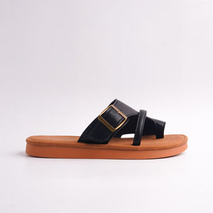 Side profile of Black Toe-Loop Slide showing the flat tan sole and gold adjustable buckle.
