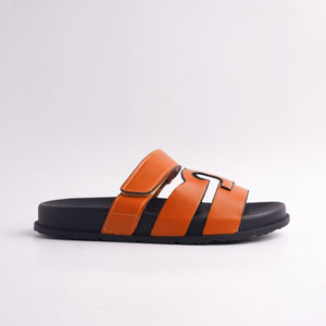 side view of Tan Cut-Out Designer-Style Slides for women with black sole, top view.