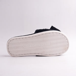 White anti-slip sole of Black Faux Fur Slides, bottom view.