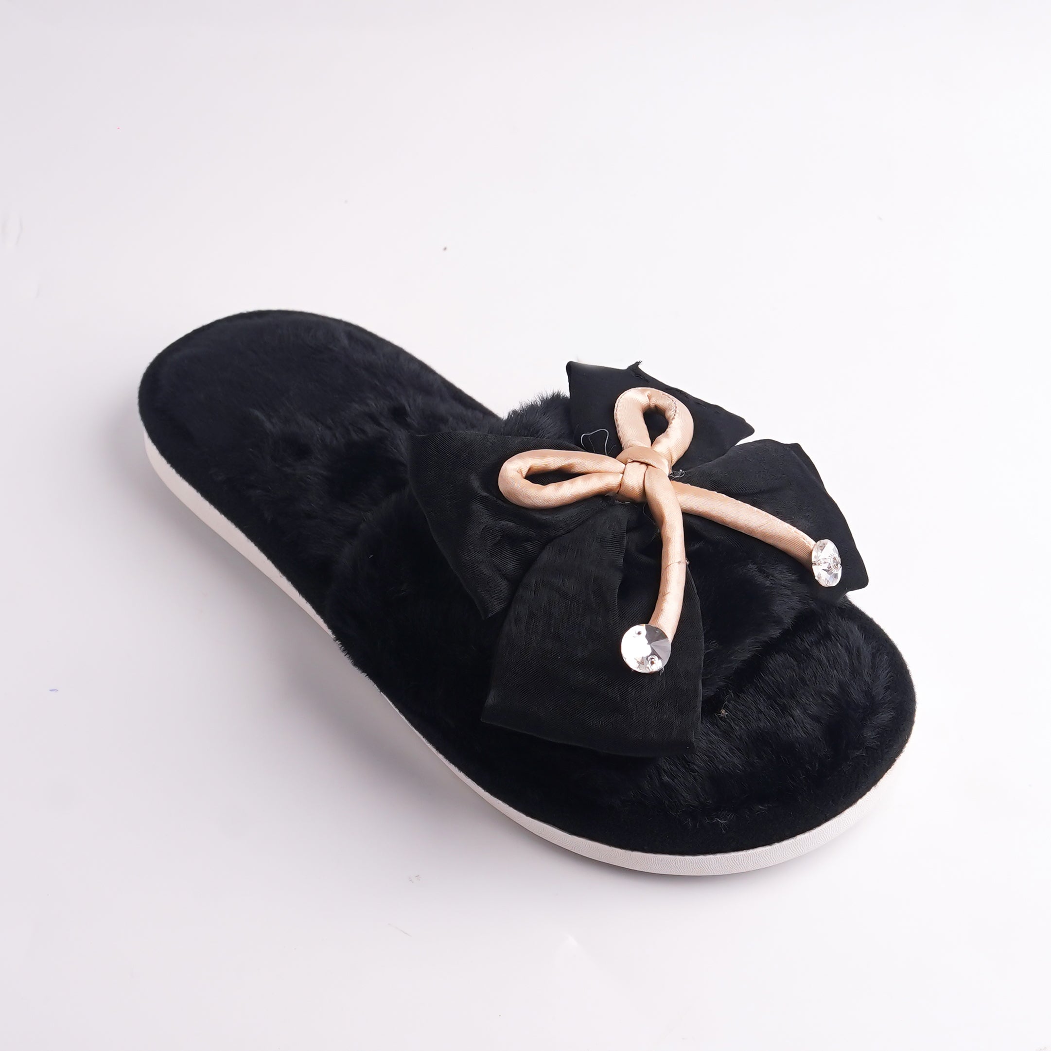 Front view of Black Fur Slide showing the plush material and the white platform sole, cozy home shoe