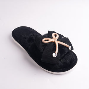 Front view of Black Fur Slide showing the plush material and the white platform sole, cozy home shoe