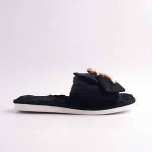 Side view of Black Fur Slide showing the plush material and the white platform sole, cozy home shoe