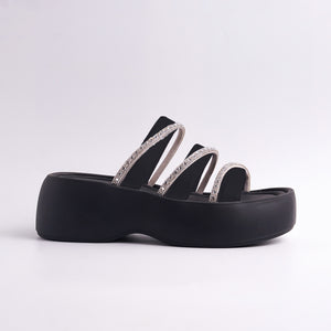 Black sandal with rhinestone straps on a white background