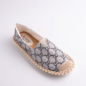 Elasticated flat shoe with chain pattern on a white background