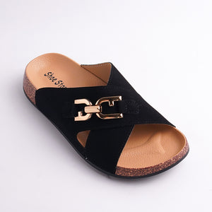Black sandal with gold buckle on a light gray background