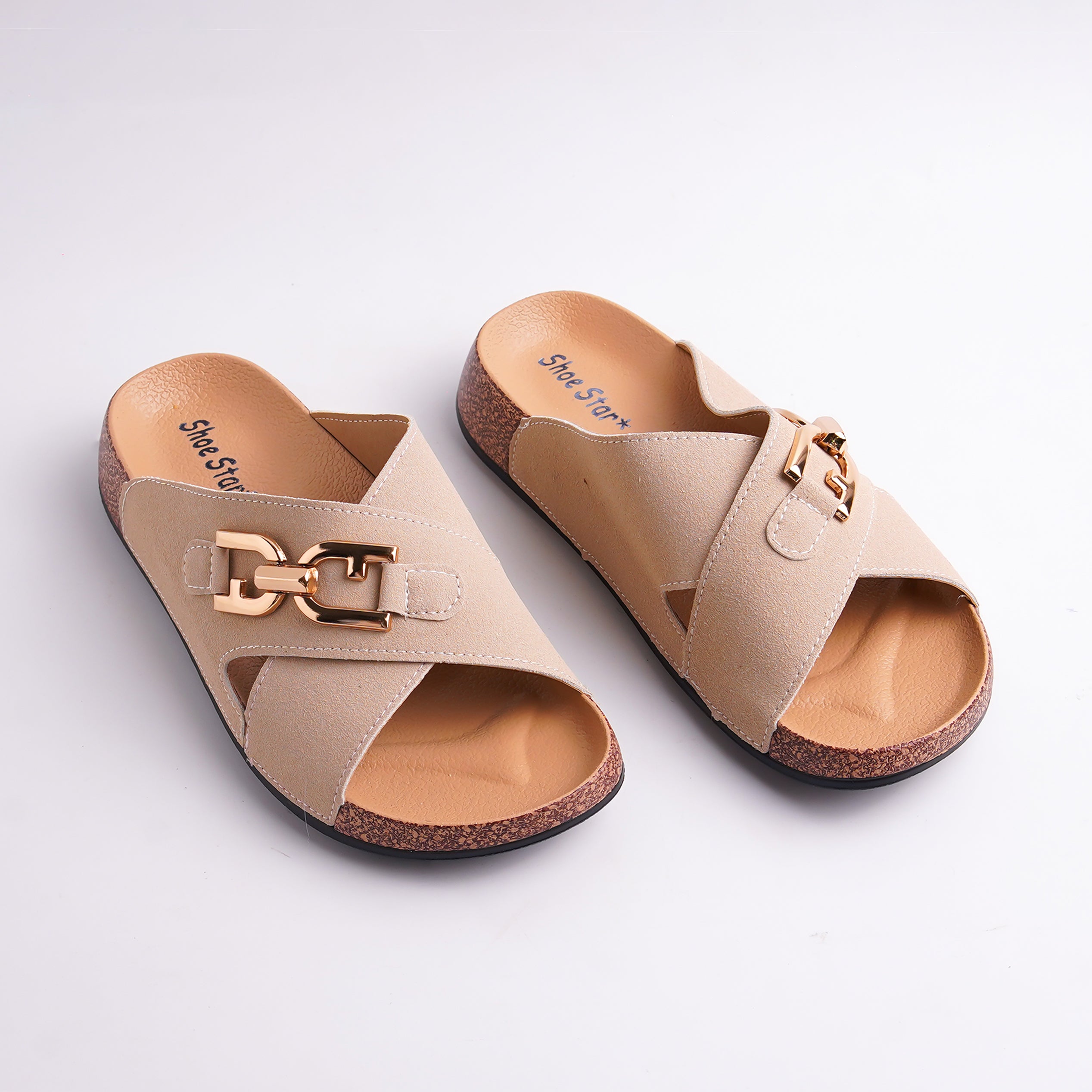 Pair of beige sandals with gold buckles on a light gray background