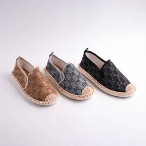 Three pairs of espadrilles with a brand logo on a white background