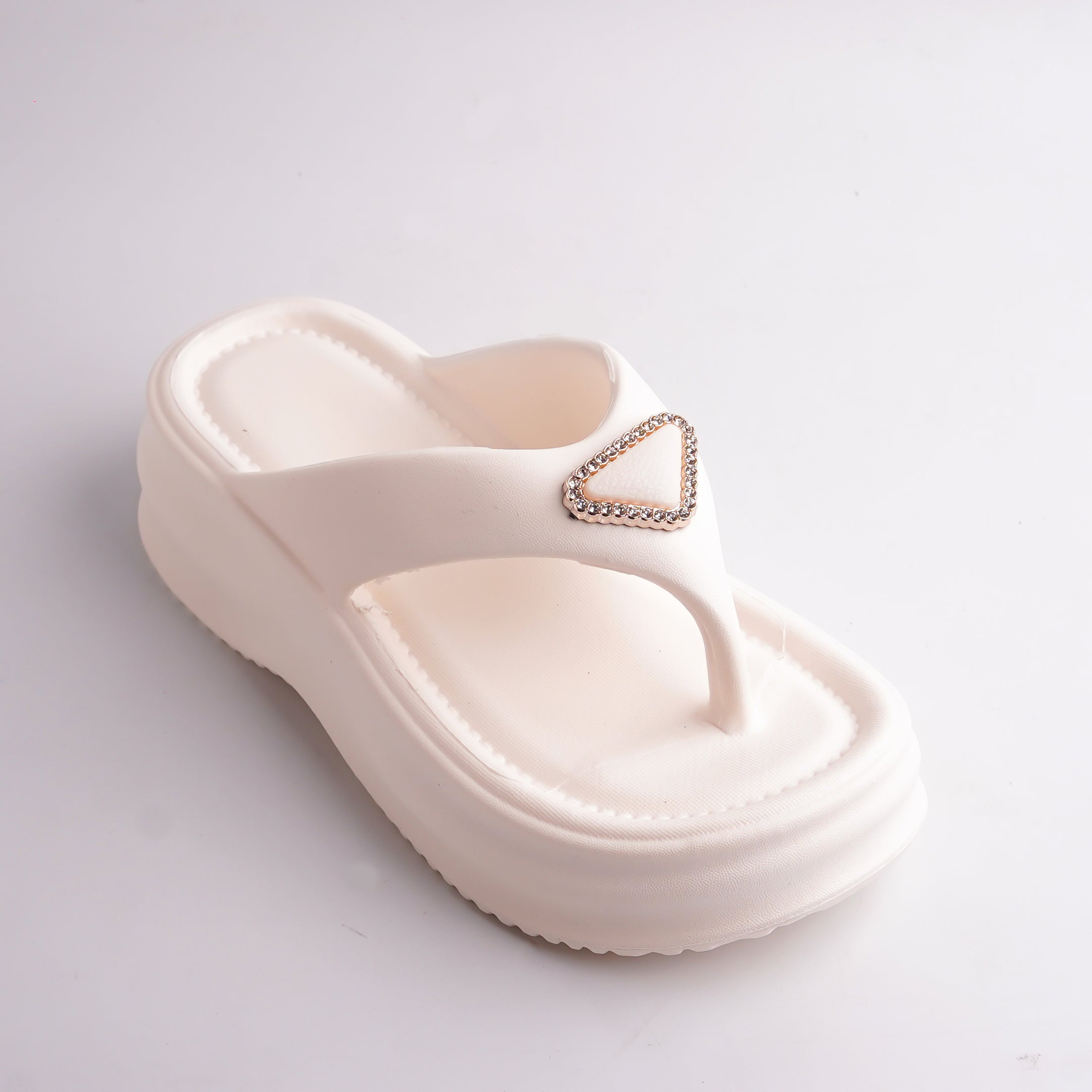 Close-up of the Cream Platform Thong Sandal showing the sparkling triangular jewel detail.