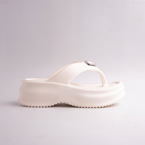 Side profile of the Cream Platform Thong Sandal showing the height of the chunky sole.