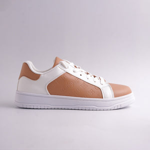 White and brown sneaker on a light gray background