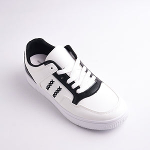 White sneaker with black accents on a light gray background