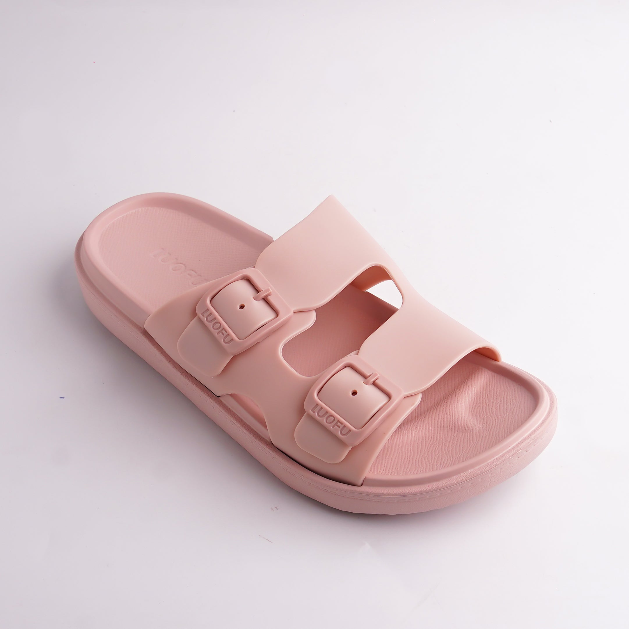 Close-up of the adjustable pink double buckle detail on the Cloud Slide.