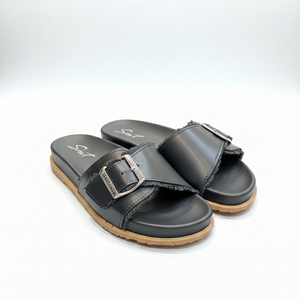 Pair of black sandals with a buckle on a white background