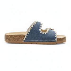 Blue sandal with cork sole on a white background