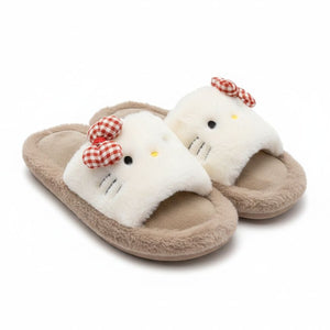 Pair of plush slippers with a cat design on a white background