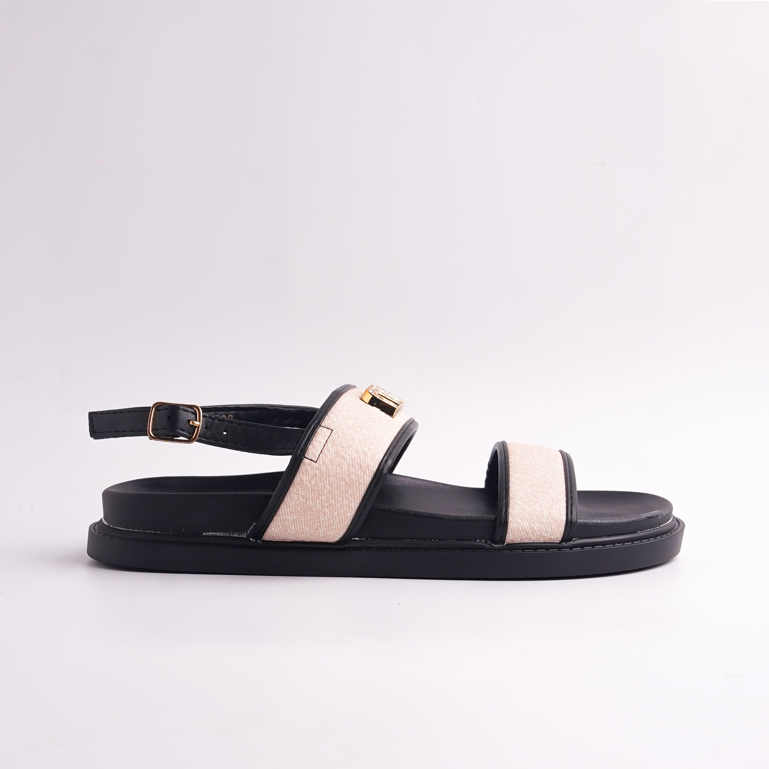 Brown sandal with beige strap on a light gray background