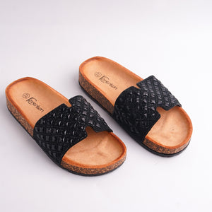 Alayna Fashion pair of Women's Black Studded Slides with natural cork sole, top view.