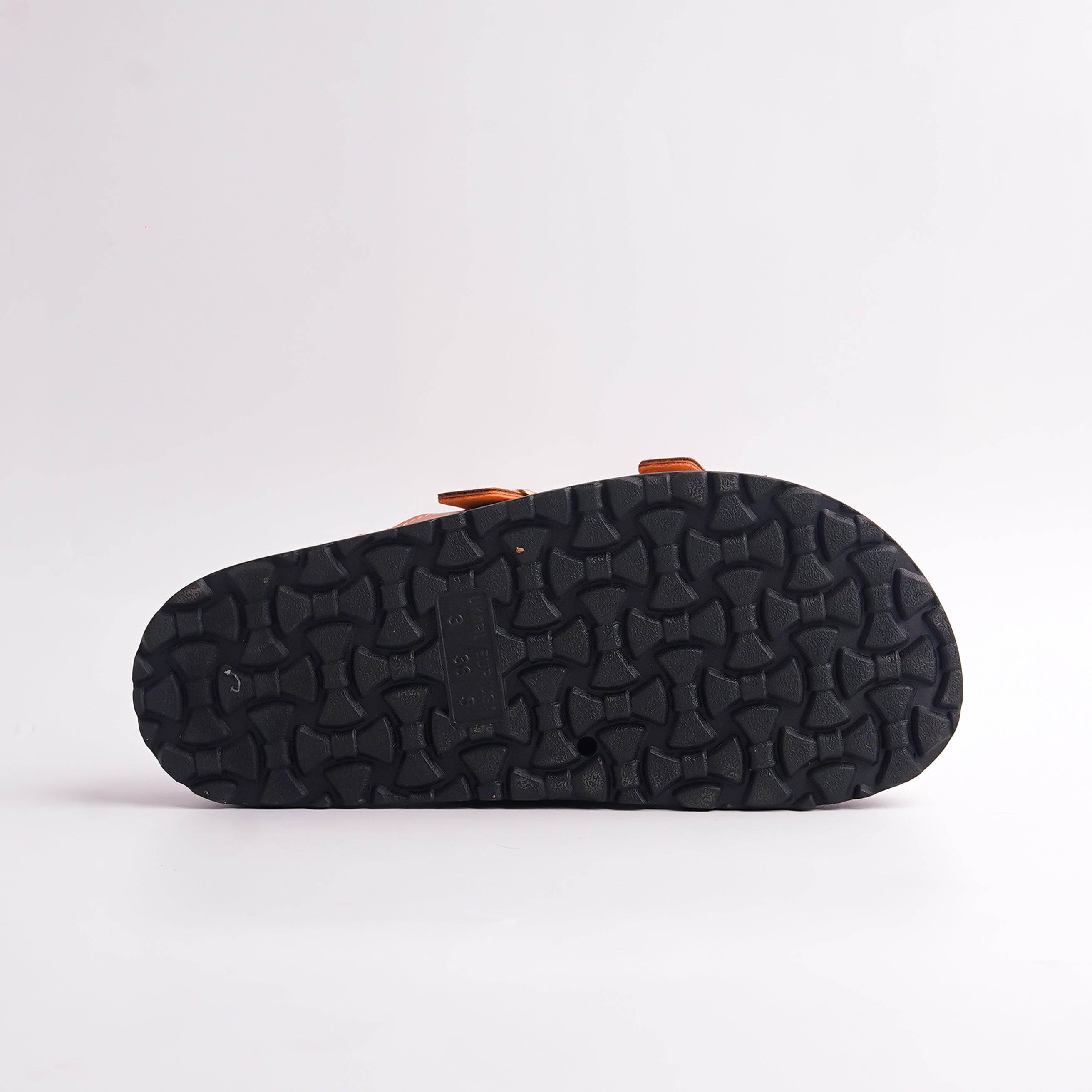 Bottom view of the Rose Gold Slide showing the black patterned anti-slip sole.