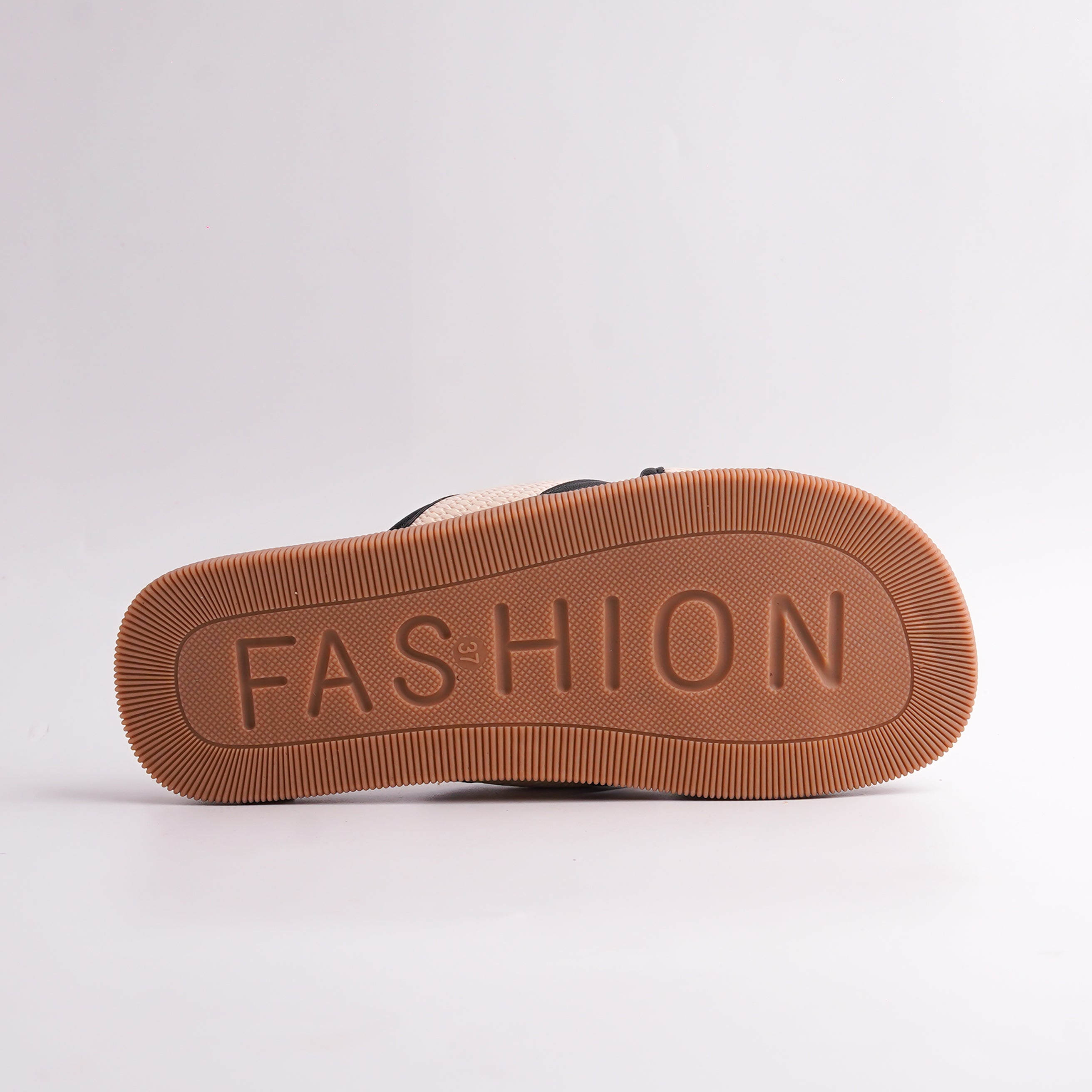 Brown shoe sole with 'FASHION' text on a white background