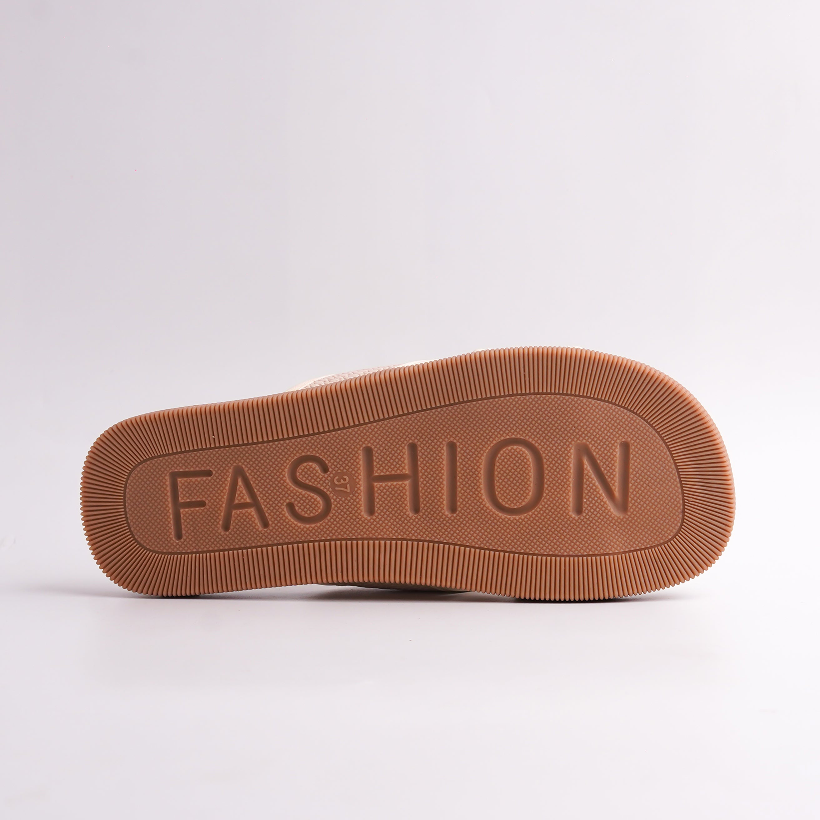 Brown shoe sole with 'FASHION' embossed on a white background