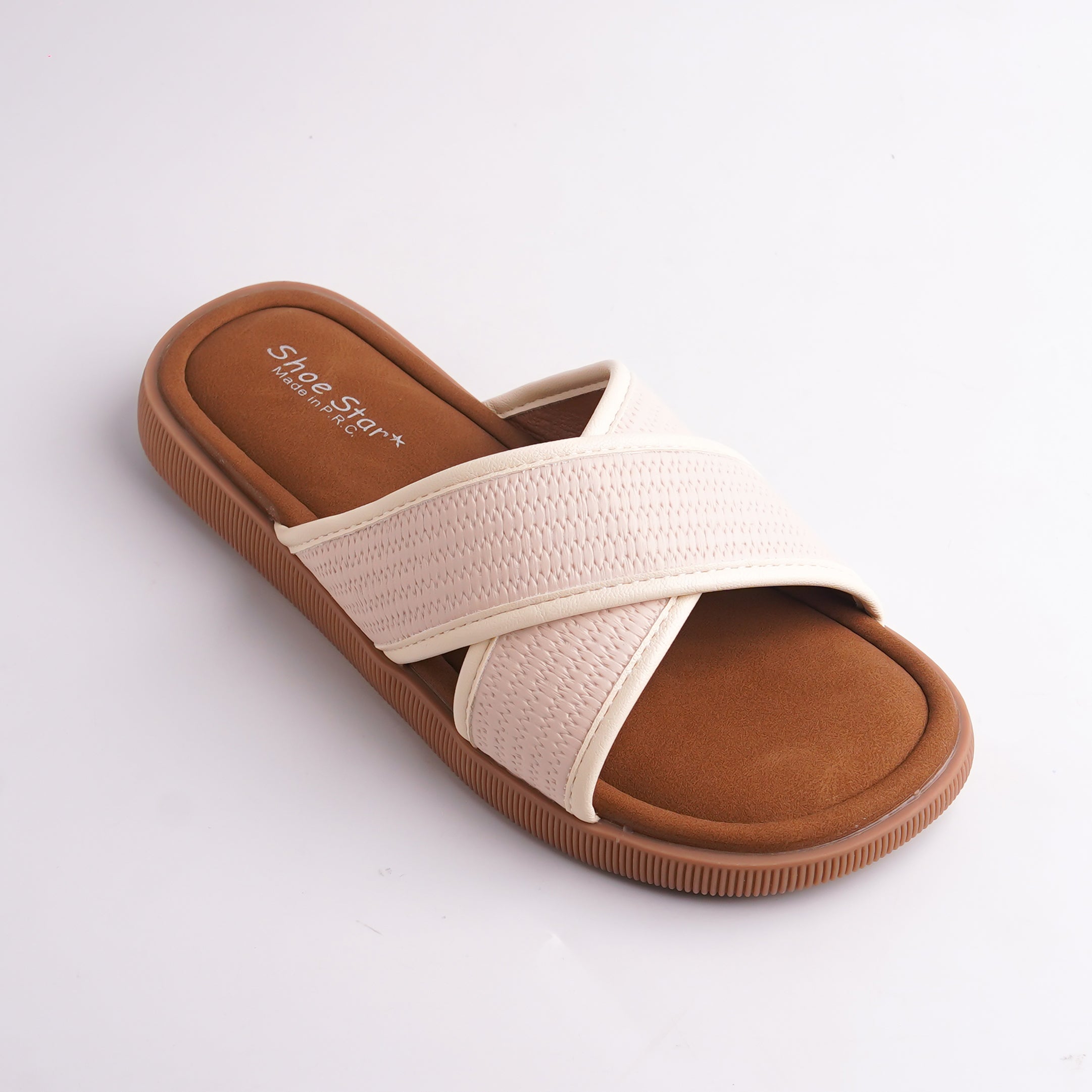 Beige sandal with brown sole on a light gray background
