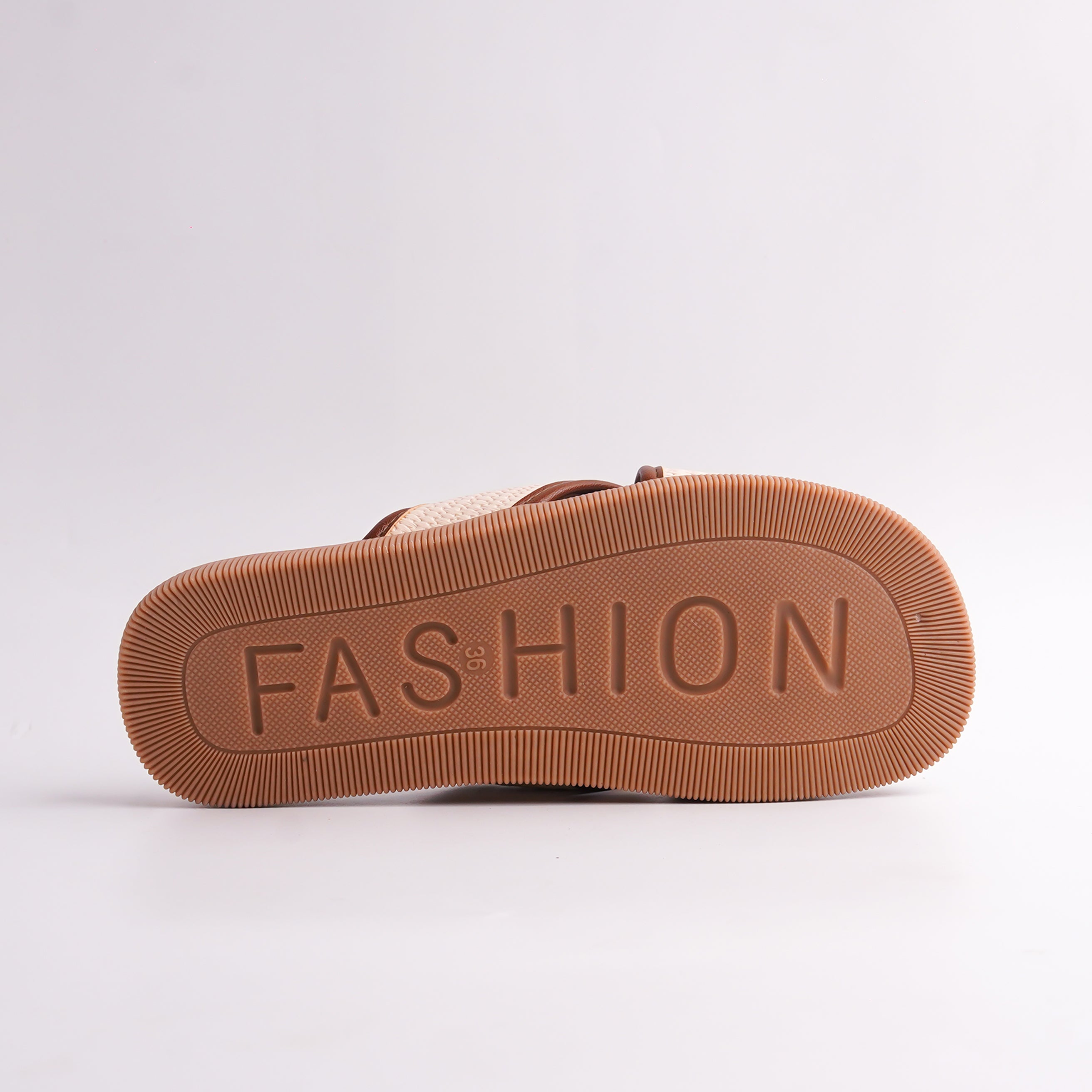 Brown sandal sole with 'FASHION' embossed on a white background