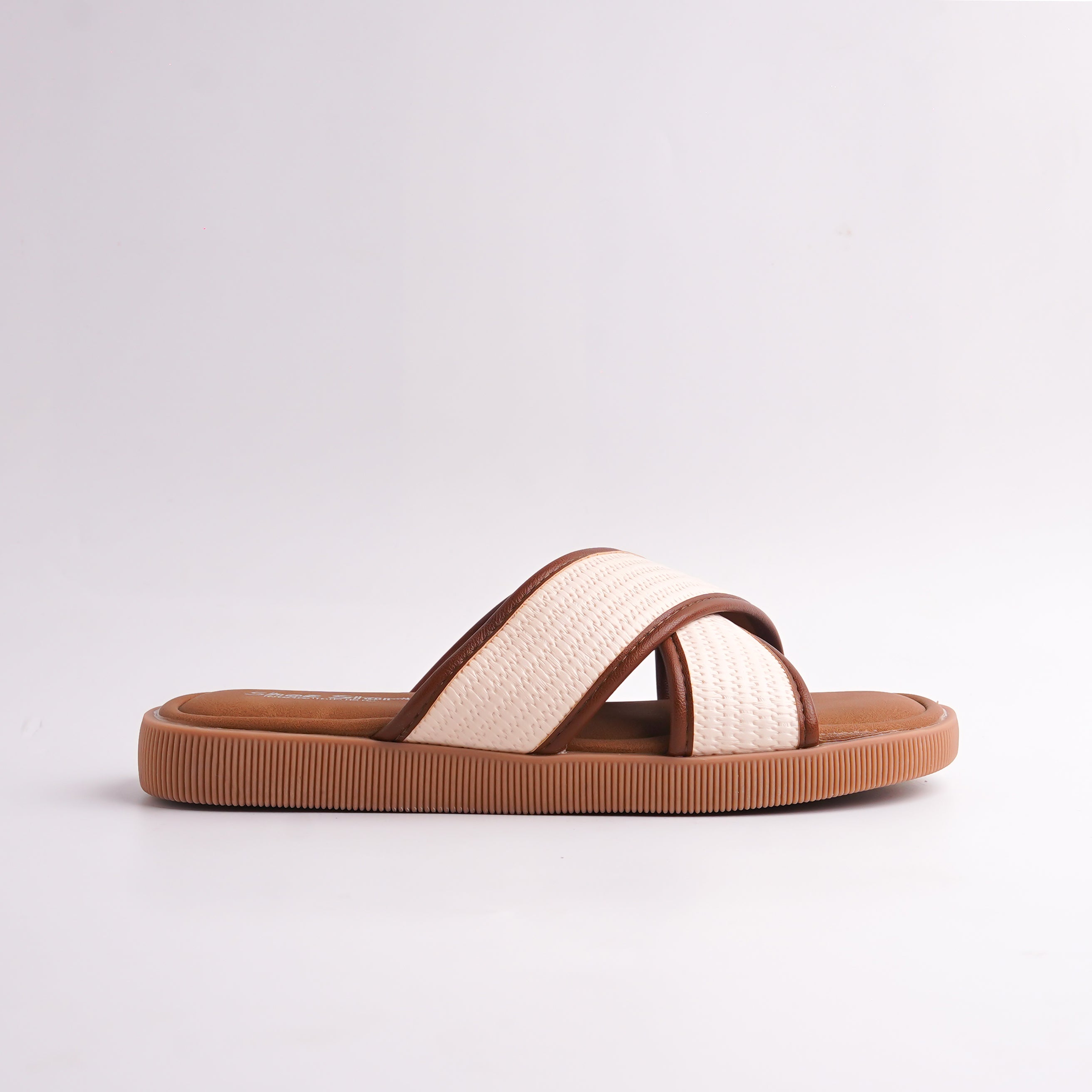 Brown and beige sandal on a light gray background