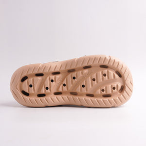 Outsole of Tan EVA Foam Clogs showing anti-slip tread and drainage holes, bottom view.