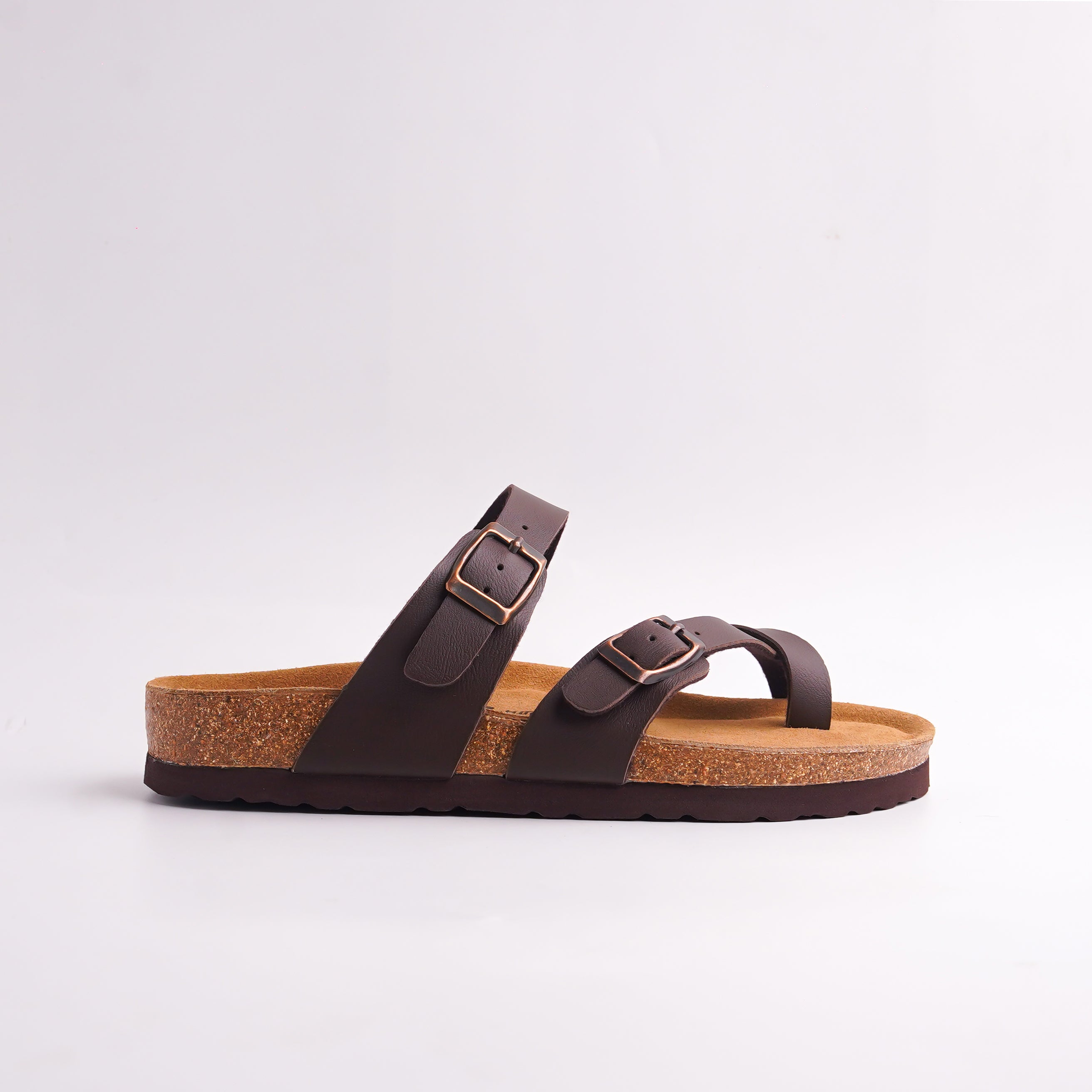 Anti-slip traction pattern on the dark brown rubber sole of Cork Footbed Sandals.