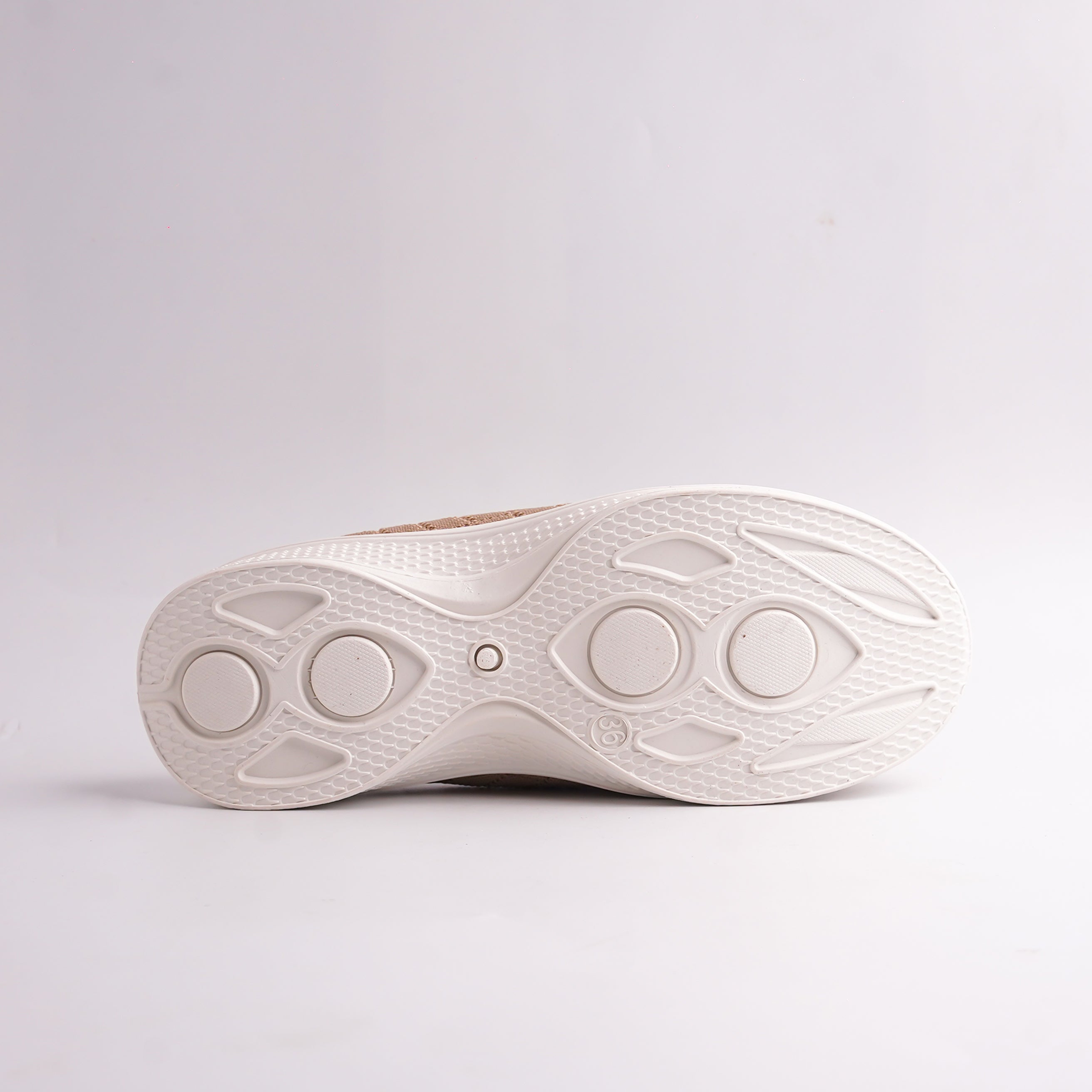 Bottom view of the white athletic sports sole of the Knit Slip-On Mule, showing the traction pattern.