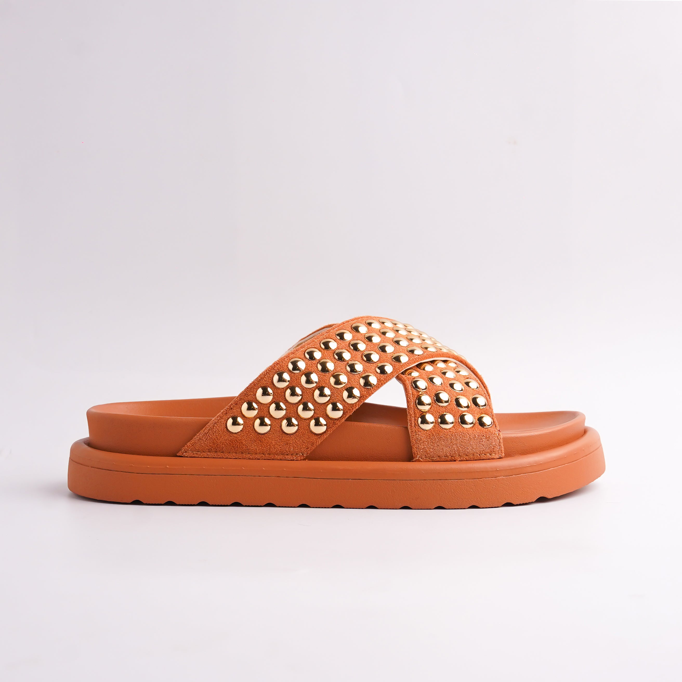 Side view of Terracotta Platform Sandals showing the gold studs on the cross-strap, casual luxury.