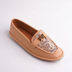 Colorful painted underside of Nude Tan Loafers sole, artistic detail.