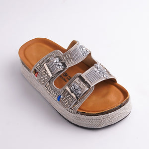 Silver embellished sandal with tan insole on a white background