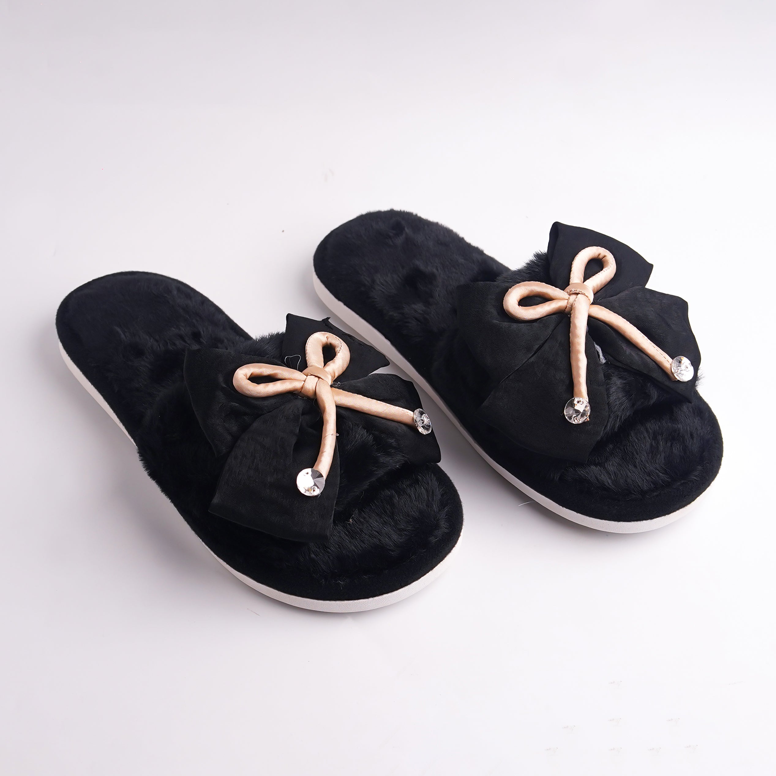 Alayna Fashion pair of Black Faux Fur Slides with tan ribbon bow and crystal accents, top view, luxury slippers.