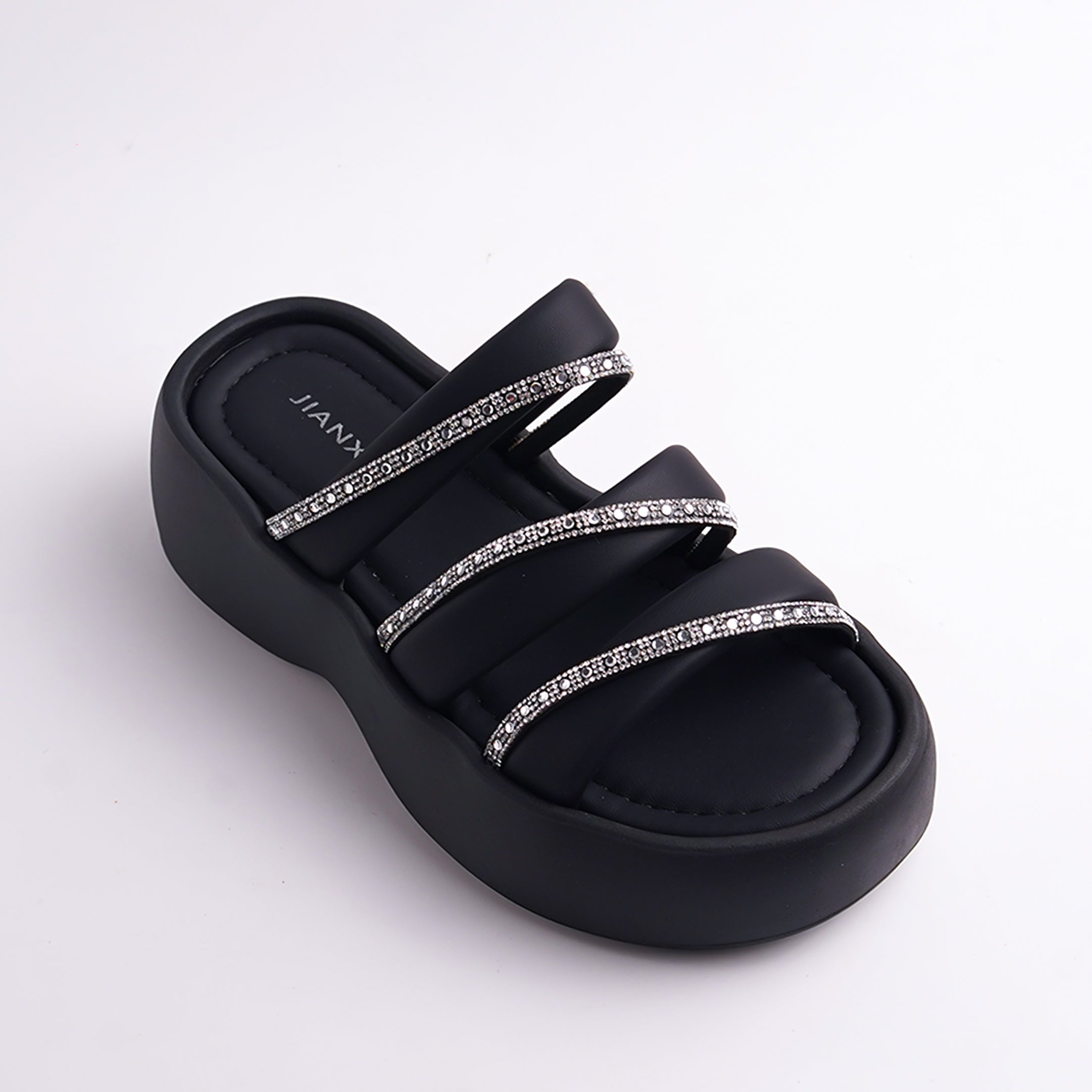 Black sandal with rhinestone straps on a white background