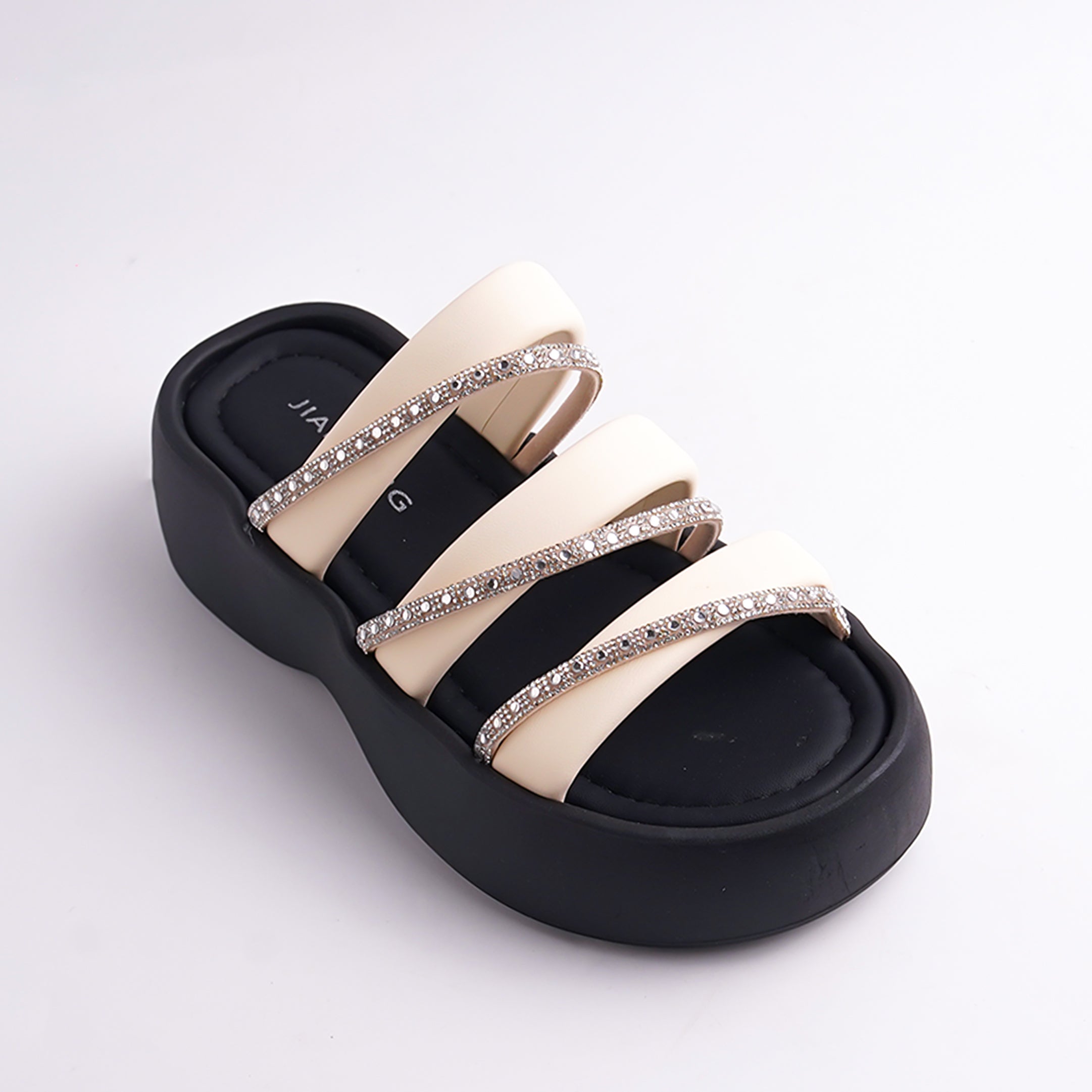 Black and beige sandal with rhinestone straps on a white background