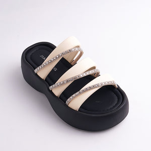 Black and beige sandal with rhinestone straps on a white background