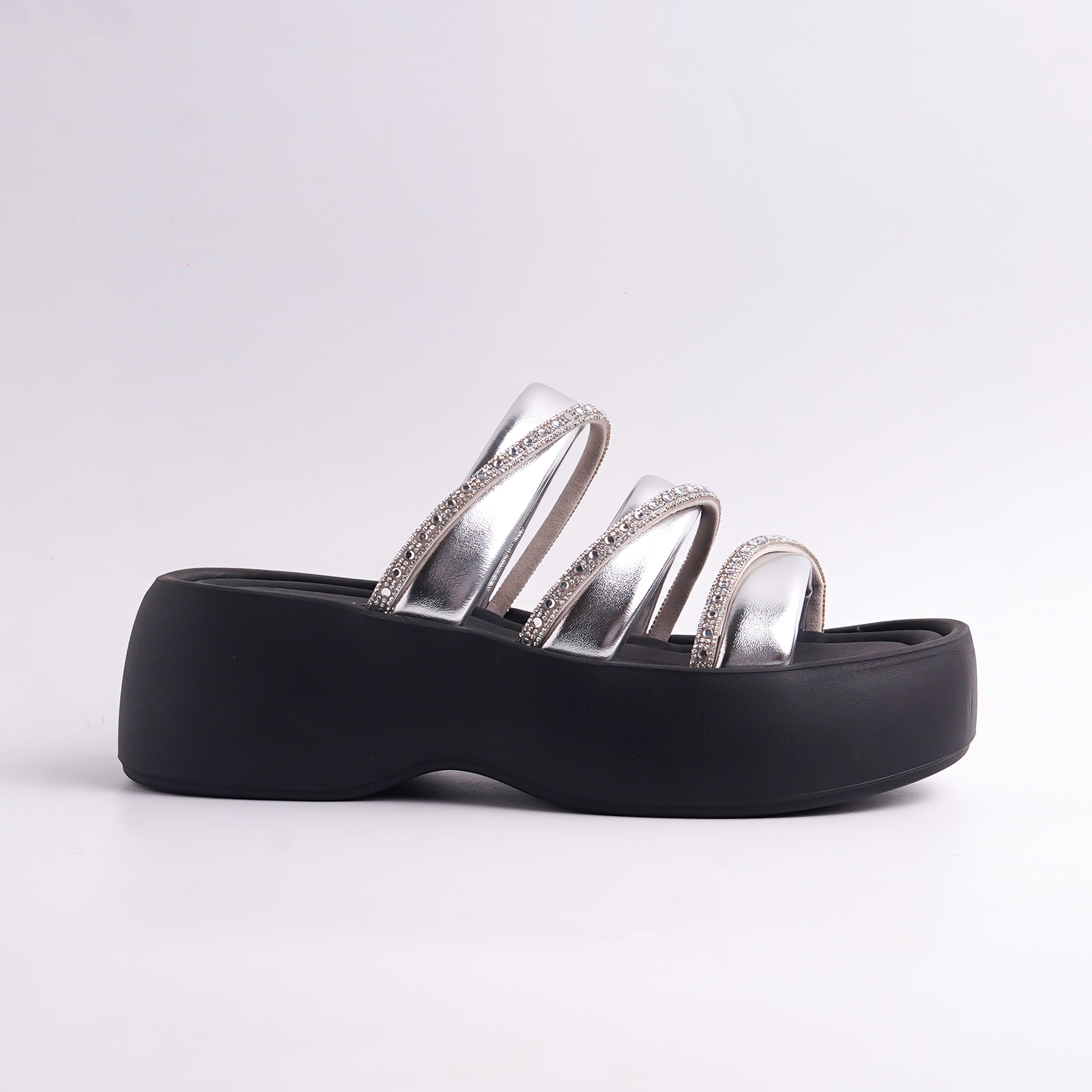 Black sandal with silver straps on a white background
