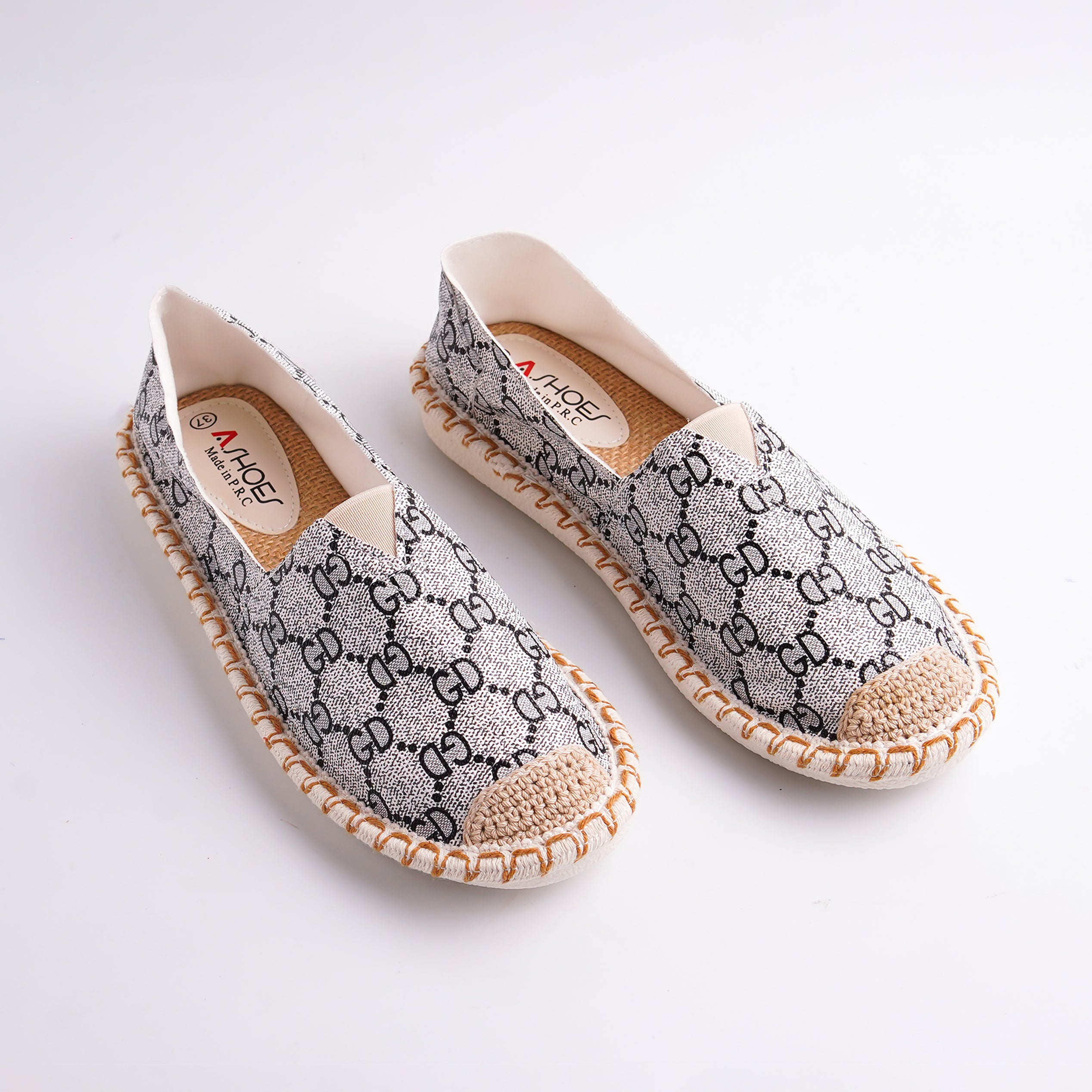 Pair of patterned shoes on a white background