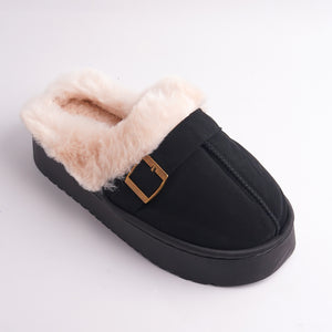Close-up of Black Faux Fur Mules showing the plush pinkish-beige lining and gold buckle detail.