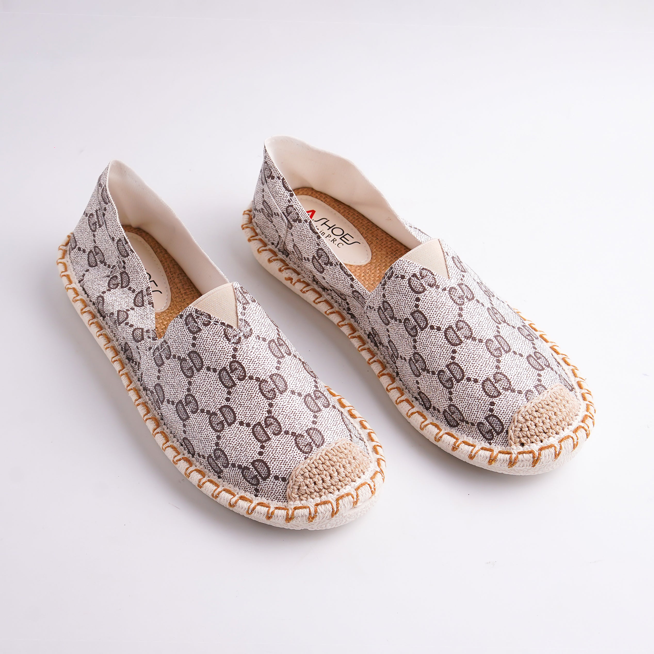 Pair of patterned shoes on a white background