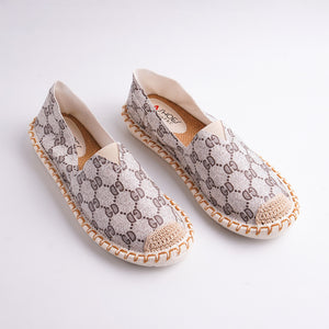 Pair of patterned shoes on a white background