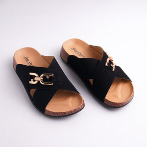 Black sandals with gold buckle on a white background