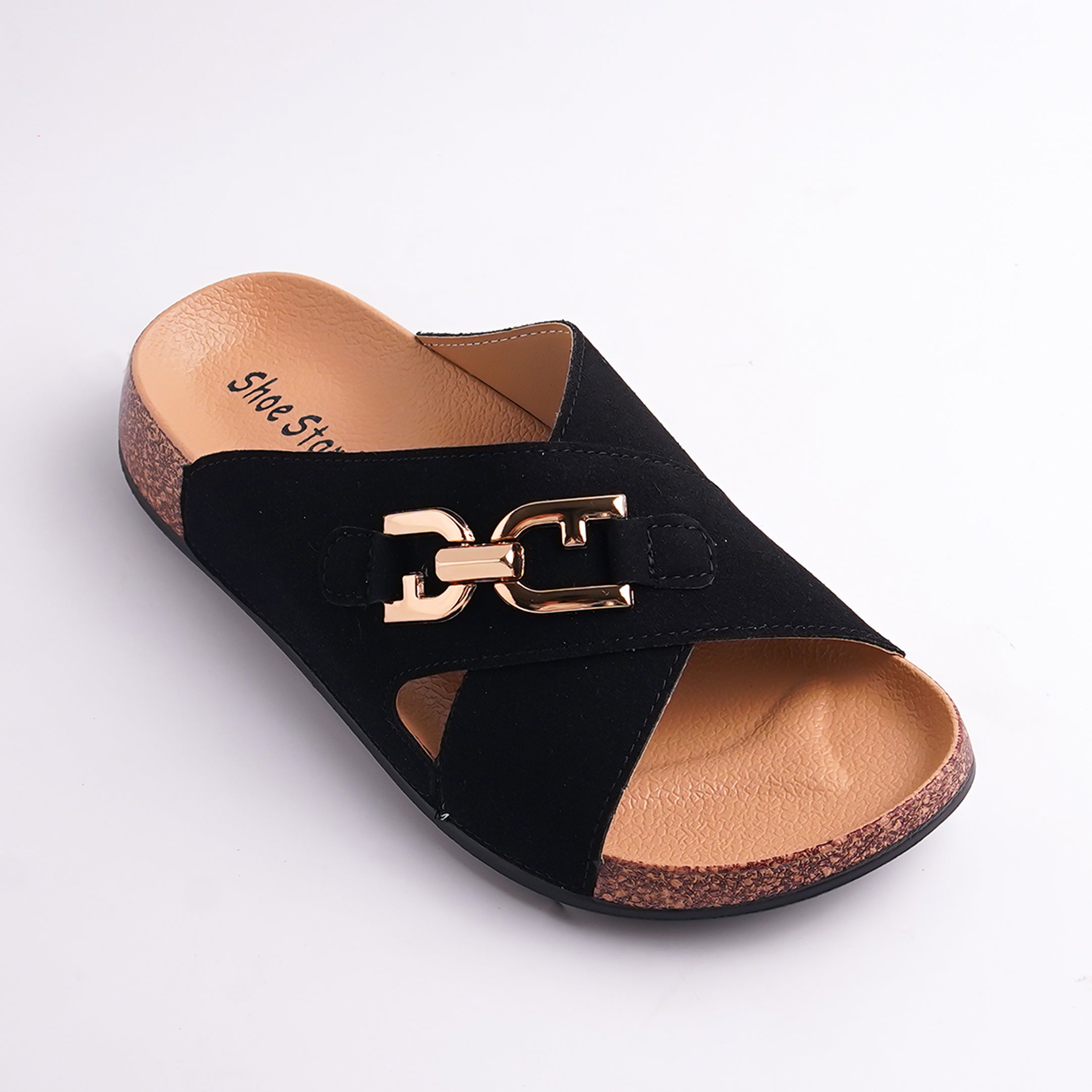 Black sandal with gold buckle on a light gray background