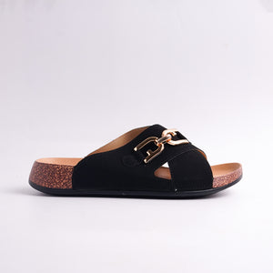 Black sandal with gold buckle on a white background