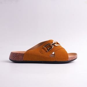 Brown sandal with cork sole on a light gray background